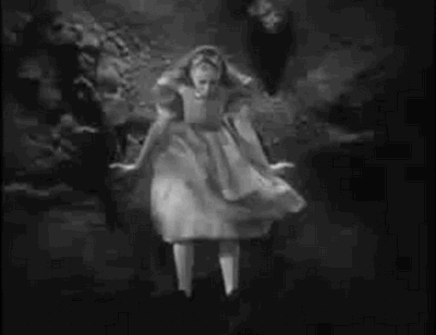 An animated gif of Allice falling down the rabbit hole